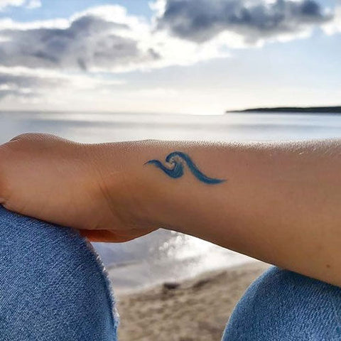 26 Super Simple Wave Tattoo Designs - TattooBlend